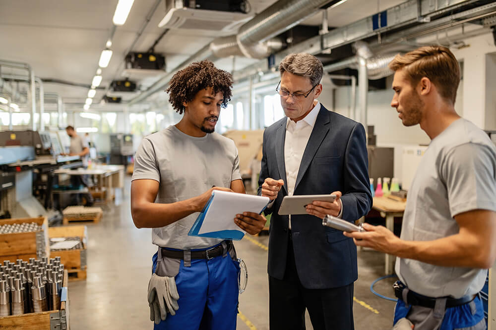 Accountant and tradesman discussing business on a clipboard