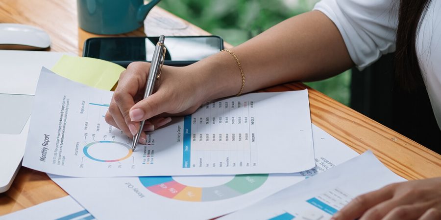 woman filling out book keeping forms