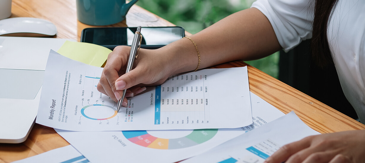 woman filling out book keeping forms
