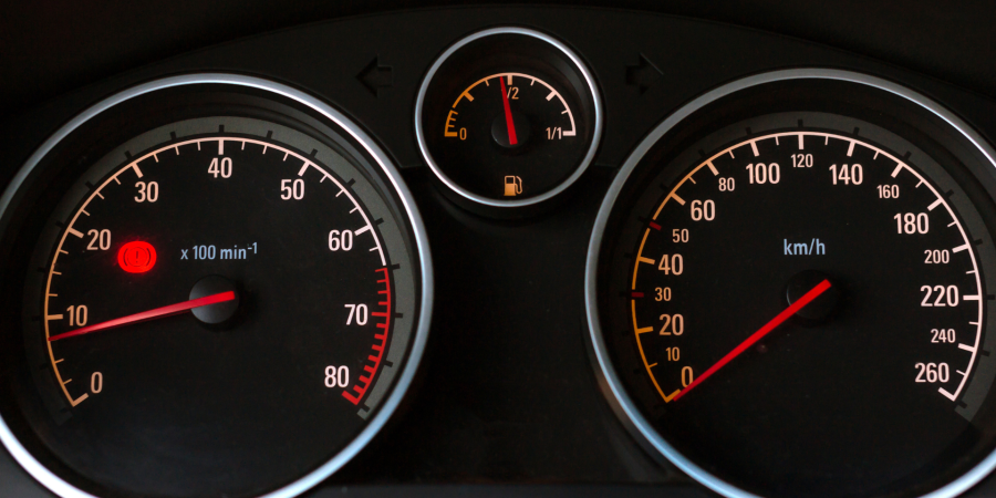 Car dashboard showing speedometer and fuel gauge used to illustrate how to claim VAT on mileage for UK businesses