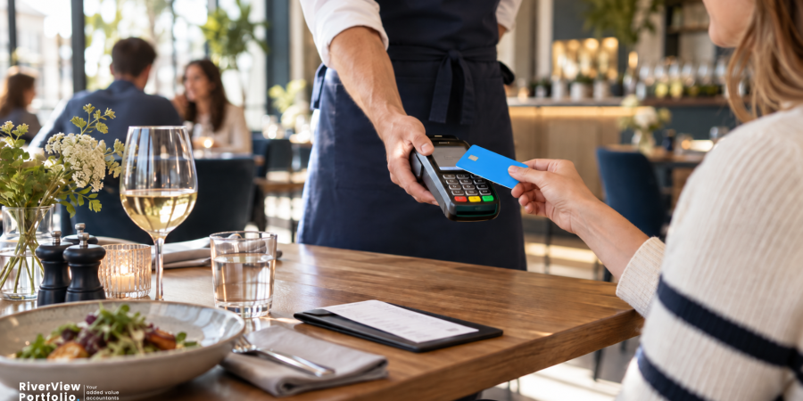 Customer paying by debit card at a restaurant, illustrating how tronc schemes work and the rules for distributing tips.